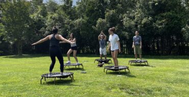 Family jumping on mini trampolines