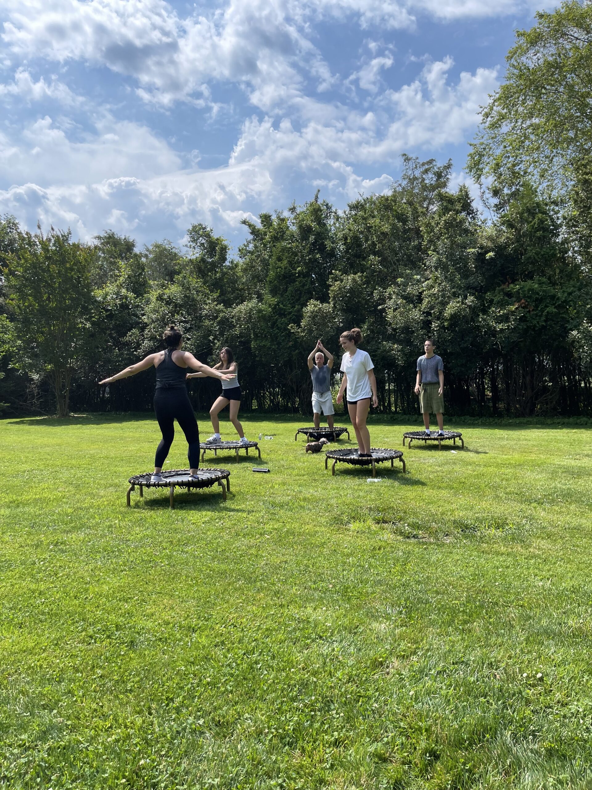 Family jumping on mini trampolines